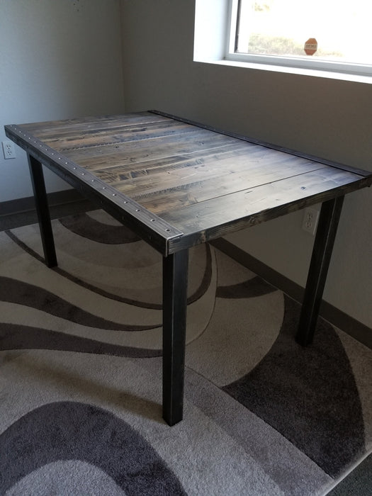 Reclaimed Distressed Custom built Industrial desk with raw steel trim and straight steel legs